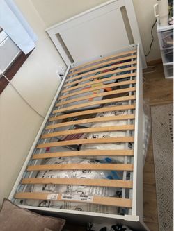 Twin bed with mattress and foam topper