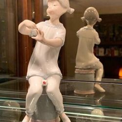 "Girl painting fingernails" retired Lladro Figurine