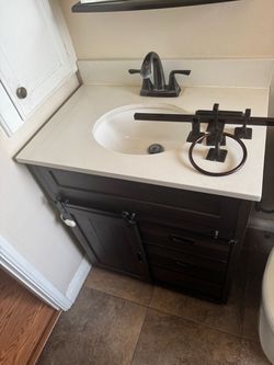 Dark Wood Bathroom Vanity with Sink and Faucet
