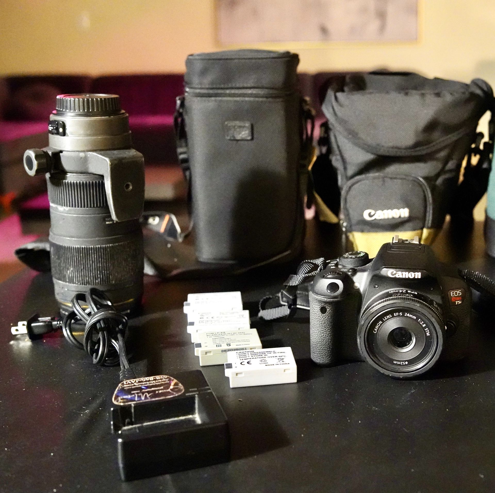 Canon camera with lens, 2 cases, 5 batteries, 2 chargers