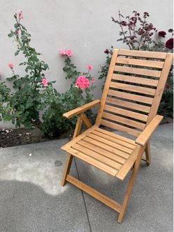Wooden reclining chair.