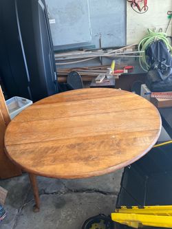 Solid wood dining table with expandable leaves