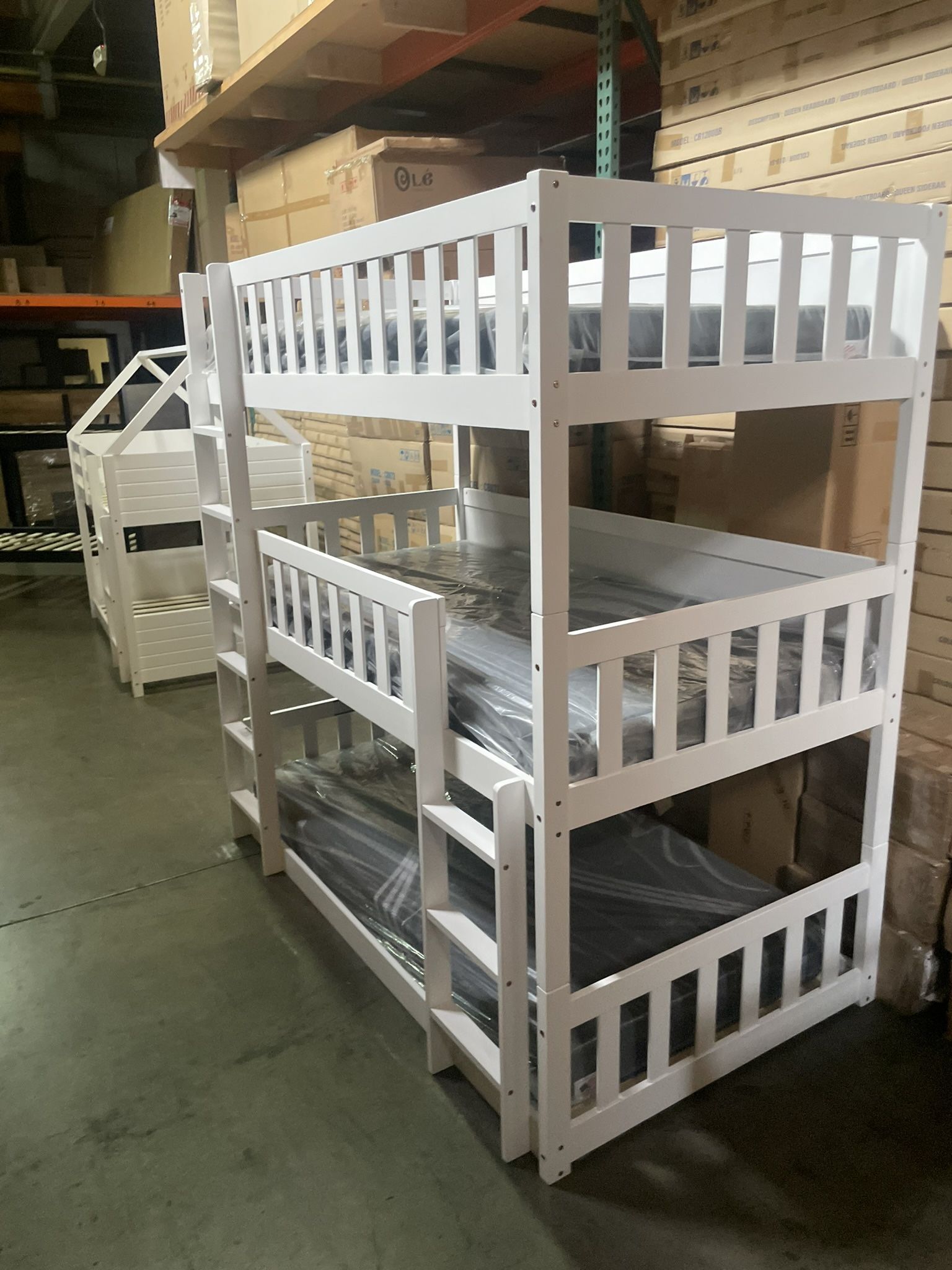 Triple bunk bed. Available in white & espresso. Assembly required. Assembly not included. Taxes included. Free delivery. Bunk bed only-$450 Bunk bed
