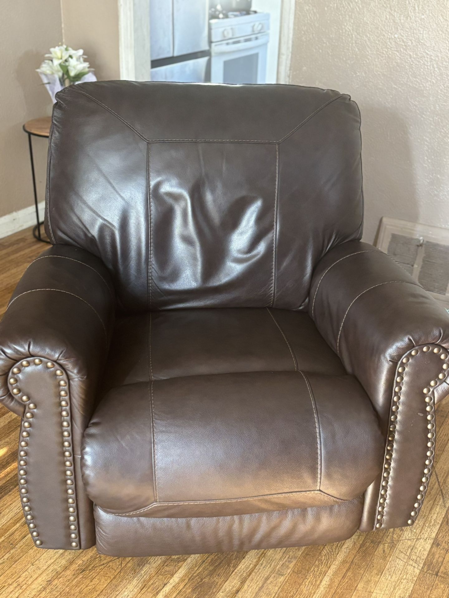 Leather couch, leather recliner, that rocks and reclines