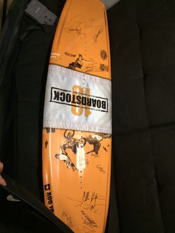 Football and surfboard autographed