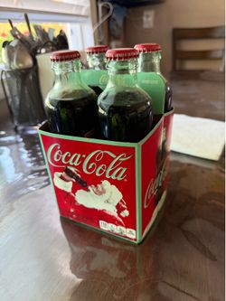 Four pack Classic Coke bottles