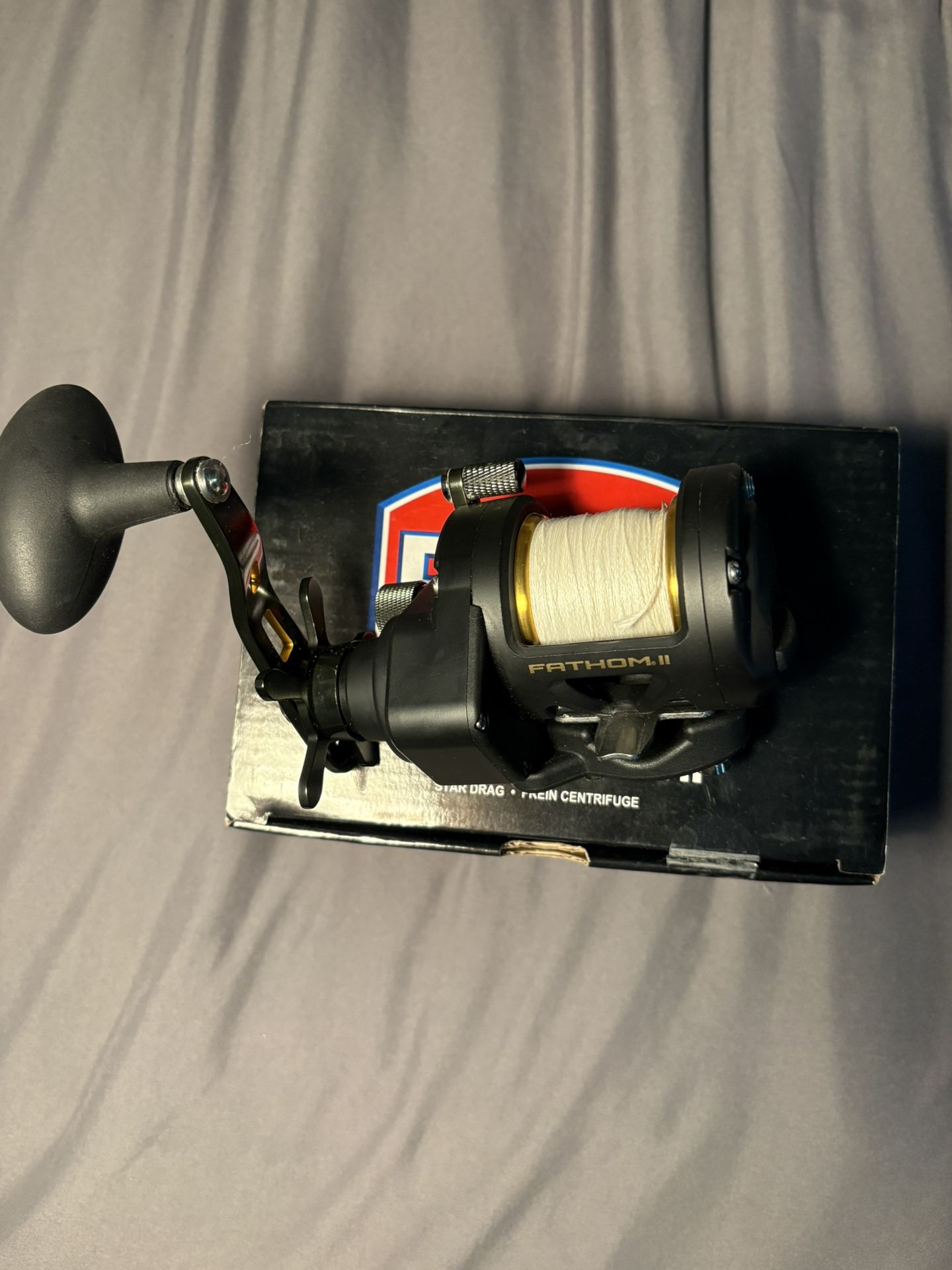 Penn fathom 12 star drag black and gold fishing reel FTHII12SD