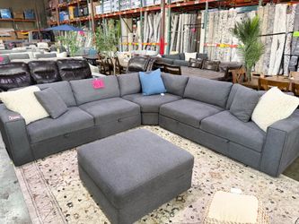 Grey Fabric Sectional with storage seats and ottoman