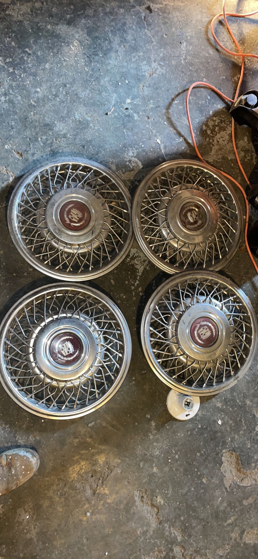 1975-85 CADILLAC DEVILLE FLEETWOOD 15″ WIRE WHEEL COVERS, SET OF 4