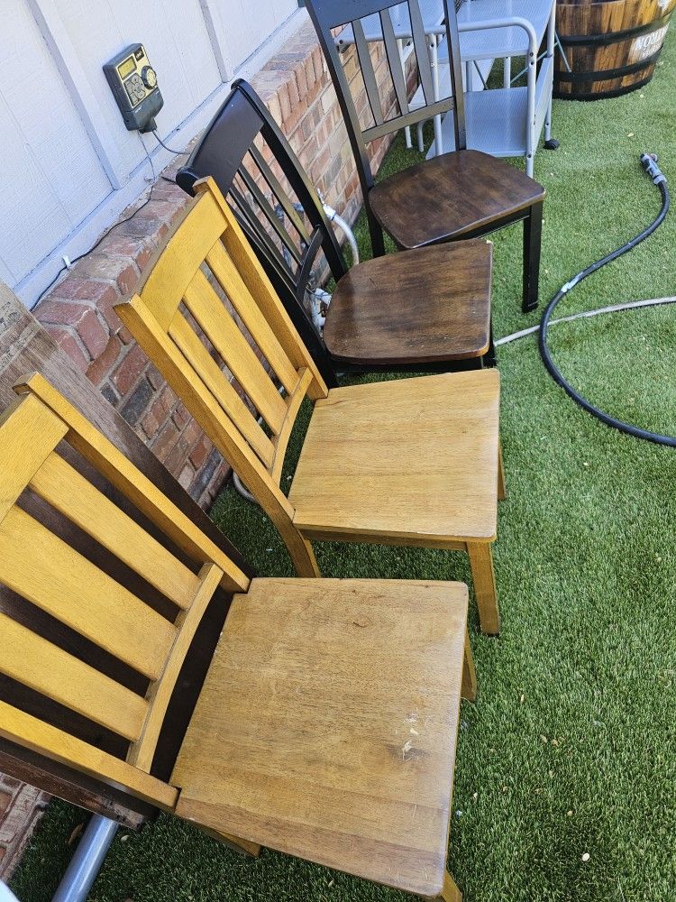 4 chairs: two are the same color and the other two are different color.