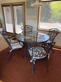 Metal dining table with glass top and 4 chairs
