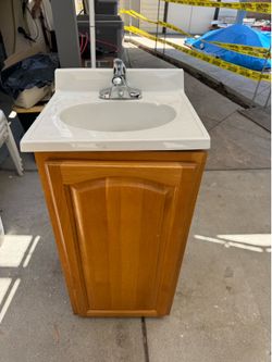 Sink faucet and cabinet