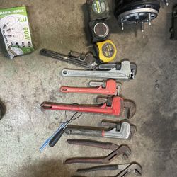 Monkey Wrench And Tape Measures