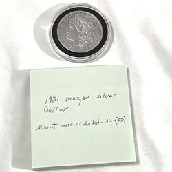 About Uncirculated-AU(50)  1921 Morgan Silver Dollar. Valued $106 On US Coin Book 