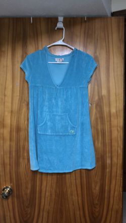 Kid’s size large (10-12) turquoise terry cloth bathing suit dress cover up hoodie with a front pocket.
