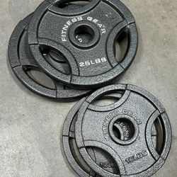 Pair Of 25 And 10 Pound Of Olympic Weights