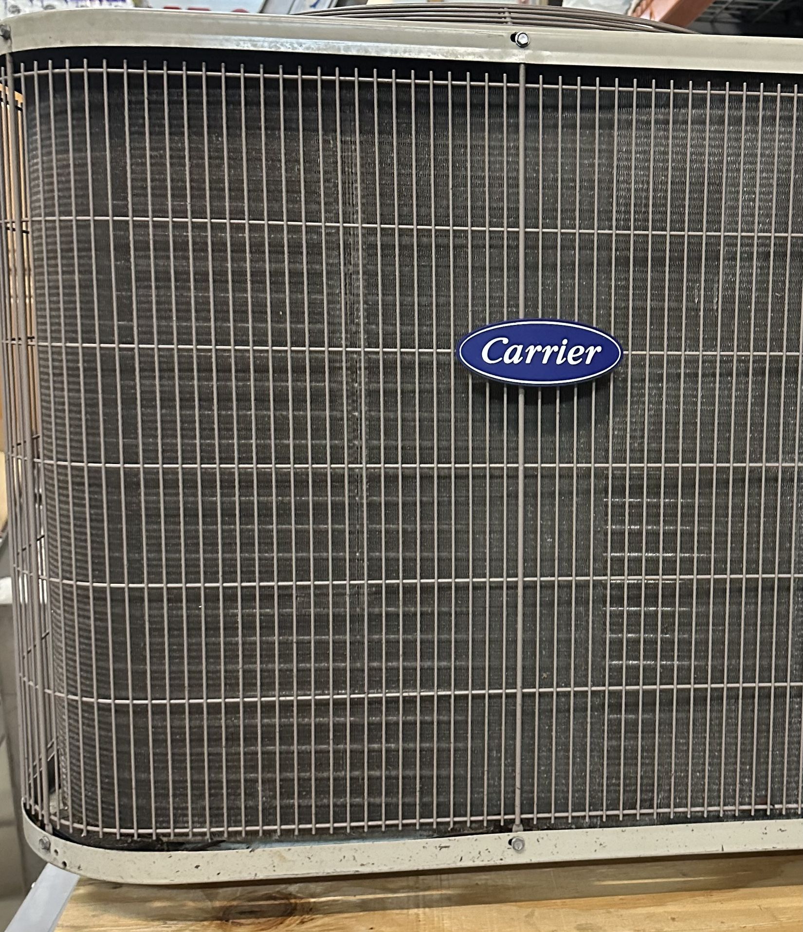 1.5 Ton Carrier Heat Pump Split System. MFD 2023