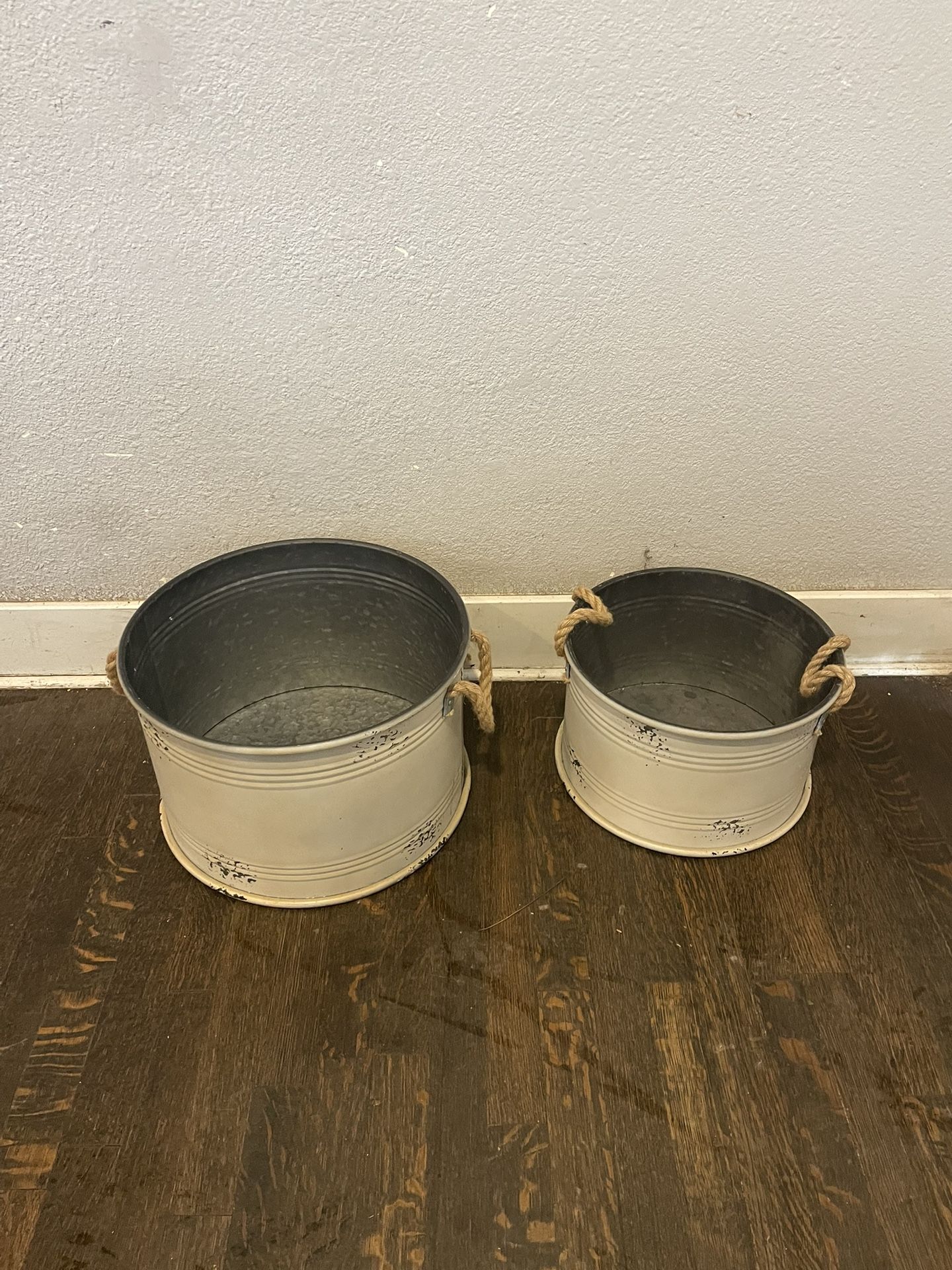galvanized metal tub with rope handles.