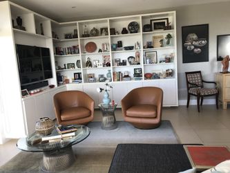 2 U-Turn Leather Swivel Chairs