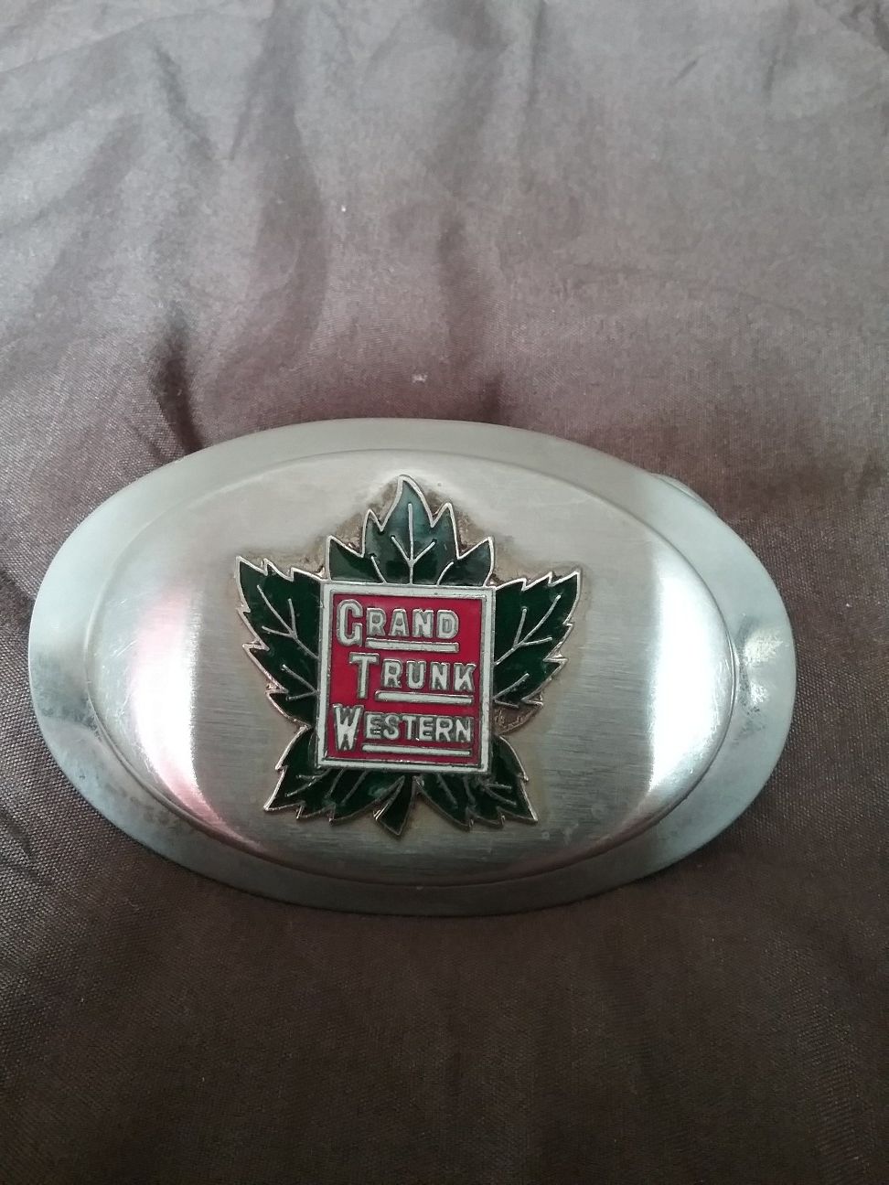 Belt buckle featuring the old Grand Trunk logo
