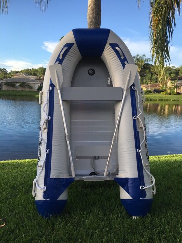 Inflatable 0.9 mm PVC rescue/dive boat with aluminum floors. Marine wood transom to mount up to 10 HP outboard motor. Includes foot pump, storage bag