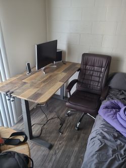 Desk/chair/monitor/ Speakers.
