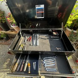 US general tool box with some tools