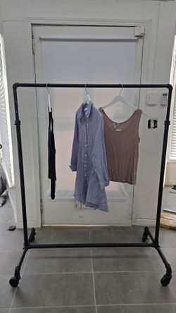 Cutom adjustable garment rolling rack.