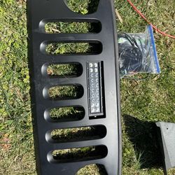 JKU 07 + angry grill with light bar.