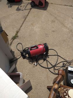 Wall mounted garage vacuum