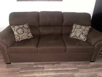 Brown sofa and loveseat set
