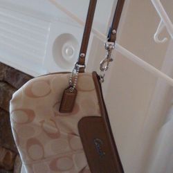 Coach- Ashley Signature Light Khaki Large Zip Wristlet.