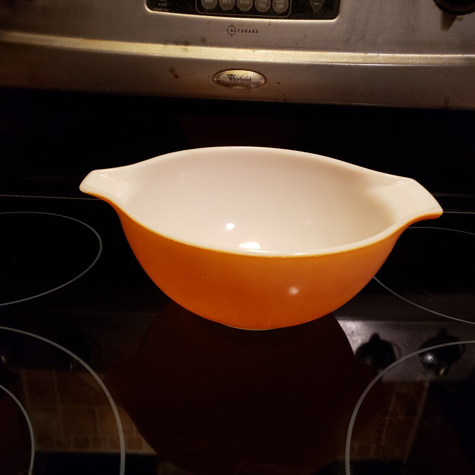 Pyrex small orange bowl..