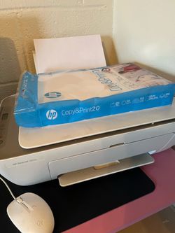 HP printer with some paper and ink inside