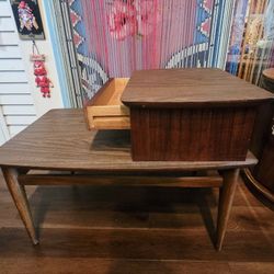Mid-Century Modern furniture piece is a Lane Telephone Table, often referred to as a "step" or "two-tier" end table. 31"×15.5"×21"