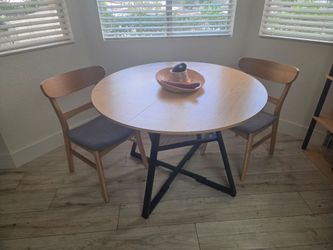 Round dining table and 2 Nathan James chairs