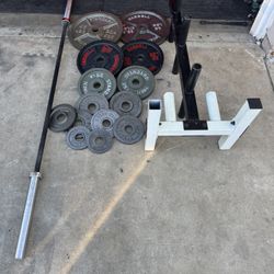 Olympic weights 255lbs total plus 7ft 45lbs bar and weights tree