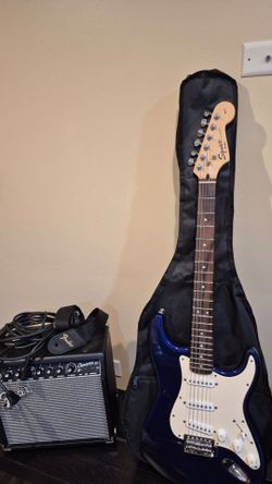 squier by Fender strat with amplifier champion 20 and gigbag