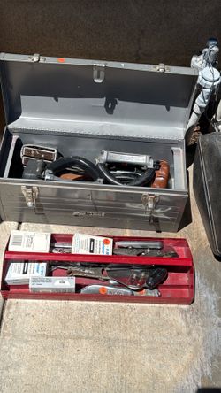 Tool box filled with carpet tool supplies