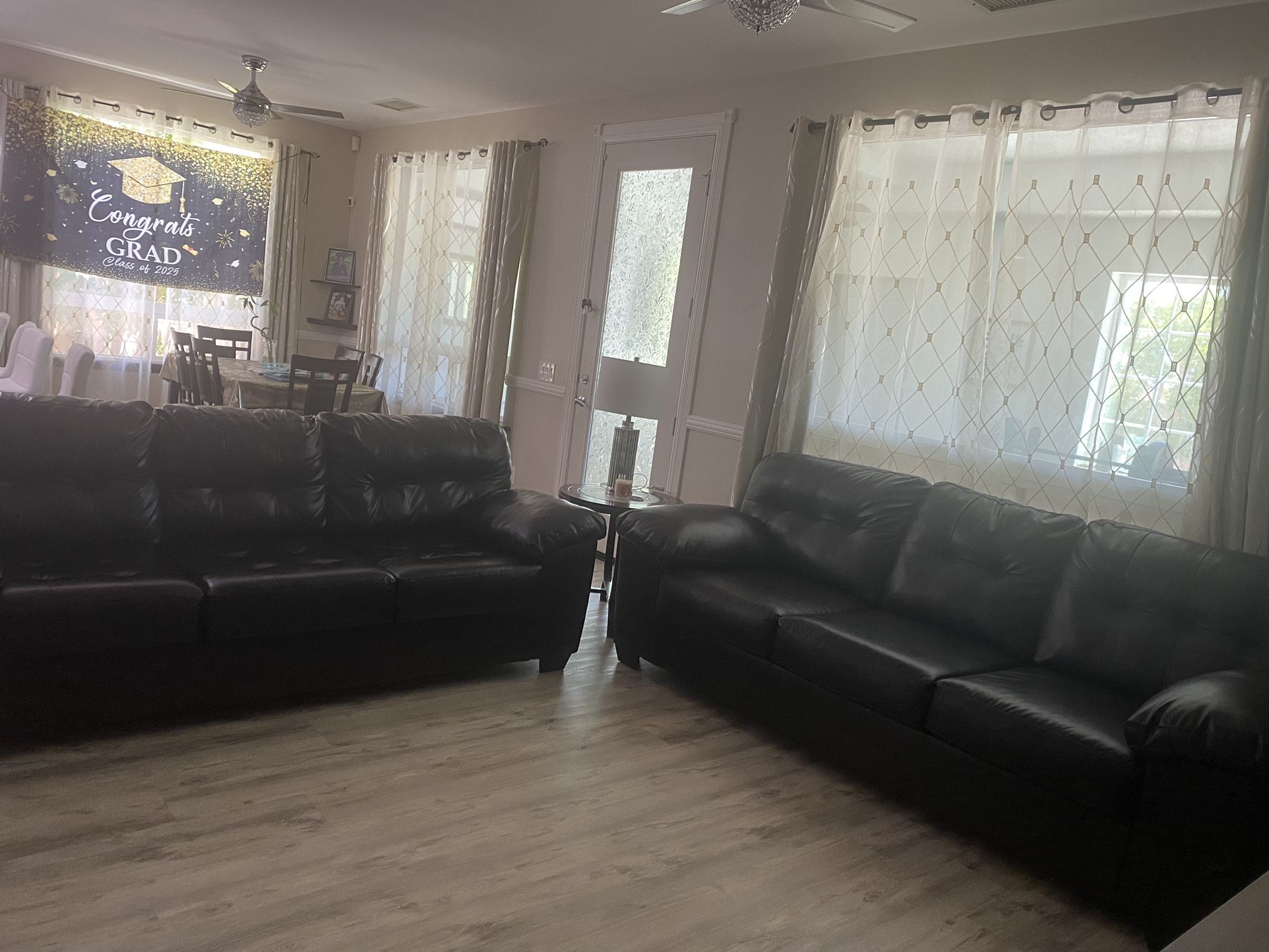 2 Leather Three-seat Couch By Ashley