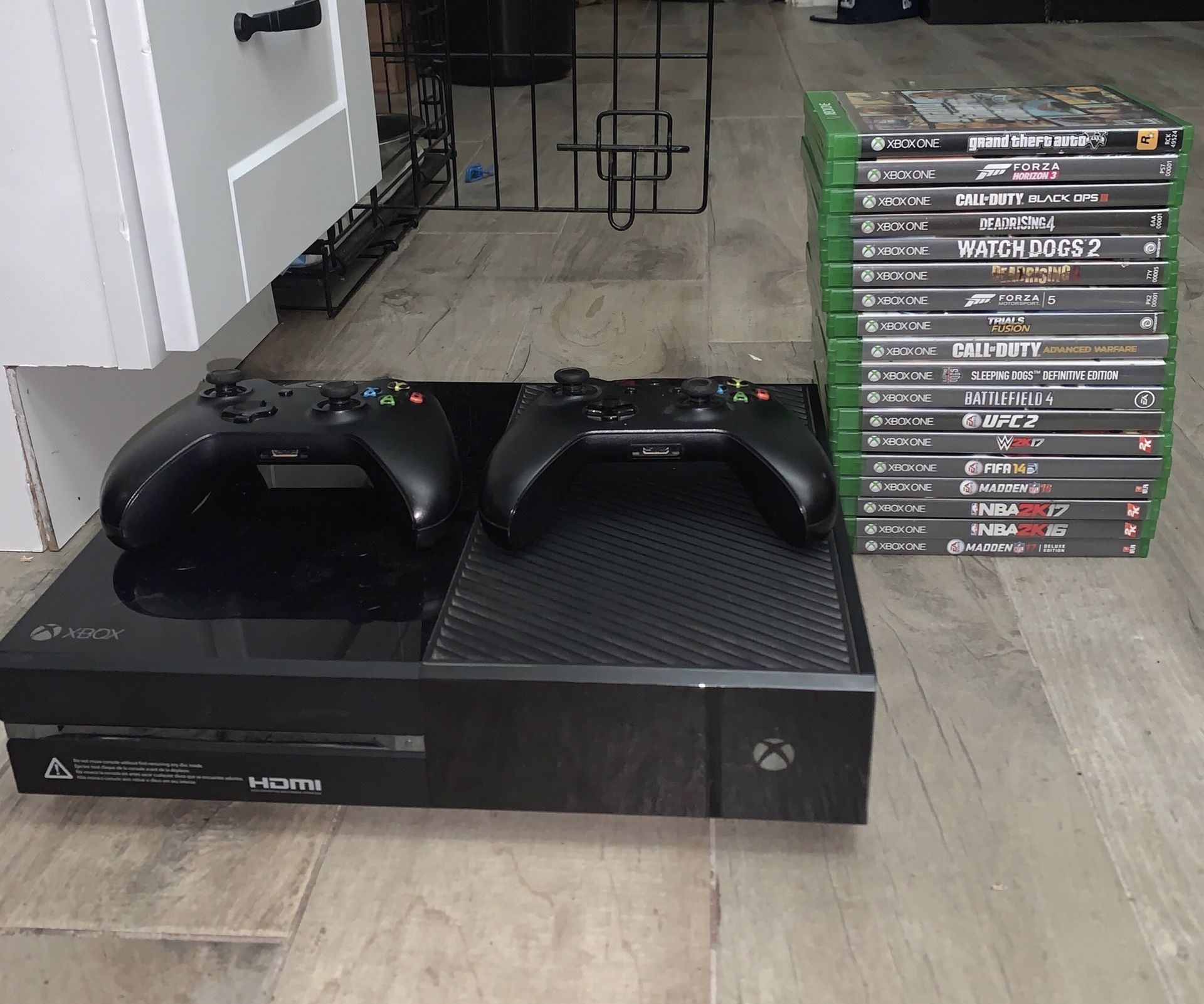 Xbox 1 with 18 games and 2 remotes.