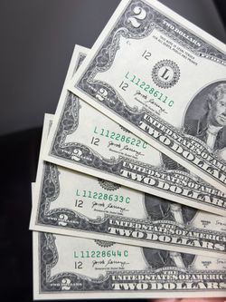 Wow 😮!! For sale is a pair of authentic U.S. $1 Silver Certificates featuring the classic blue Treasury seals.  Included:  * 1935E $1 Silver Certific