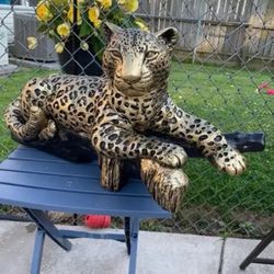 Golden Leopard On The Log Statue