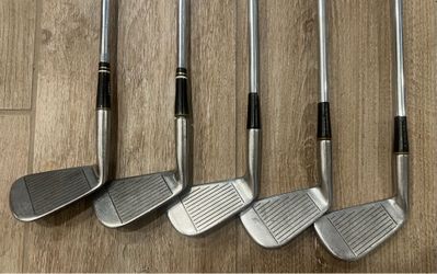 Titleist Acushnet AC-108 forged cavity-back irons. Partial matching set includes 2, 3, 5, 6, and 8 irons. Right-handed with steel stiff-flex shafts