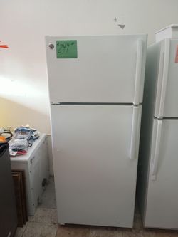 GE Refrigerator white excellent condition . Warranty . Delivery available . 2203 Fowler st. Ft. Myers 33901
