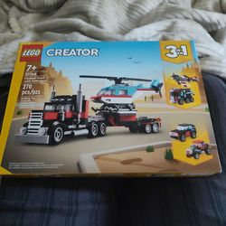 Flatbed truck with helicopter