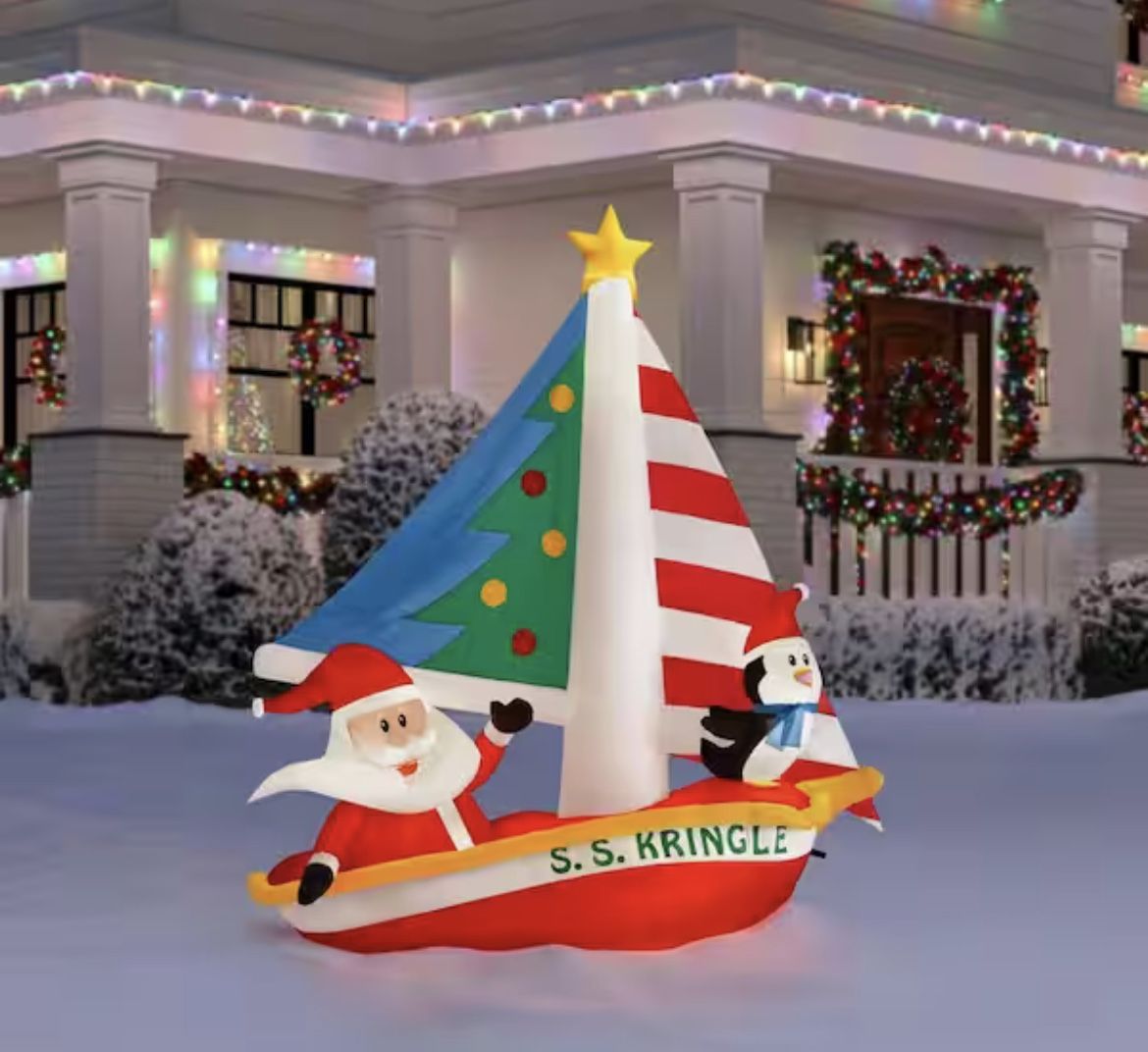 7.5 ft. Santa and Penguin in Sailboat Inflatable