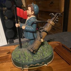 Approx. 8” tall, solid cast iron. Very heavy, classic figural design. Great as a functional doorstop or golf-themed décor.