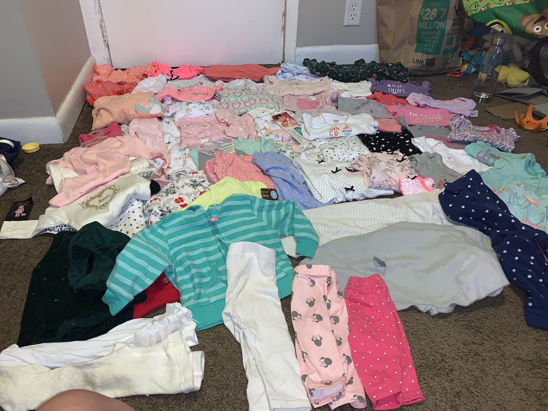 Over 100 pieces of baby girls clothing from newborn to 9 month .