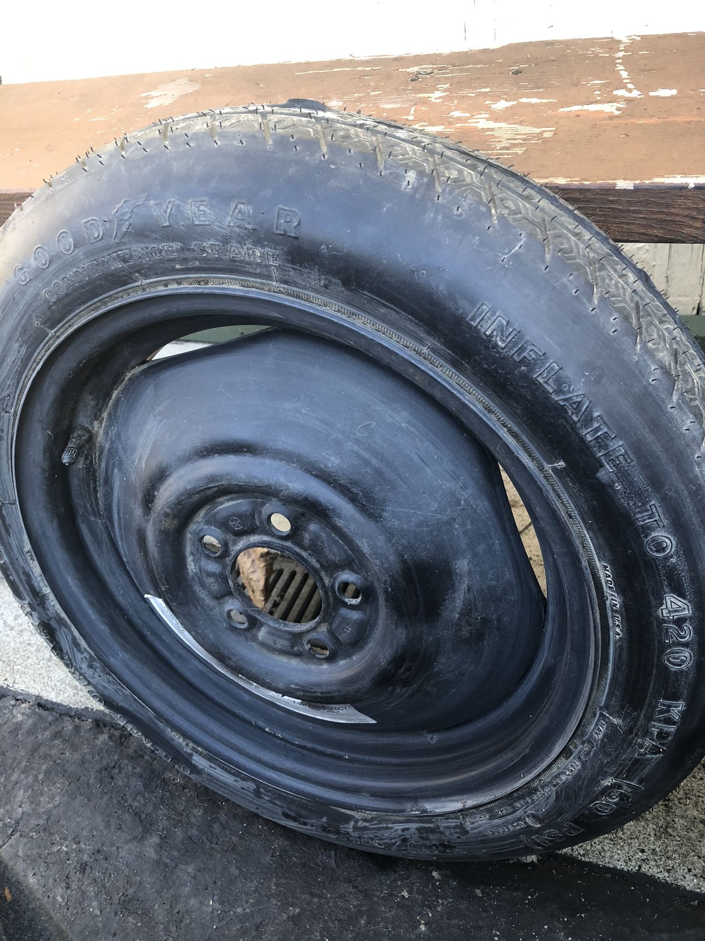 Two. Donut tires, five lug size. T 125/90 D 16